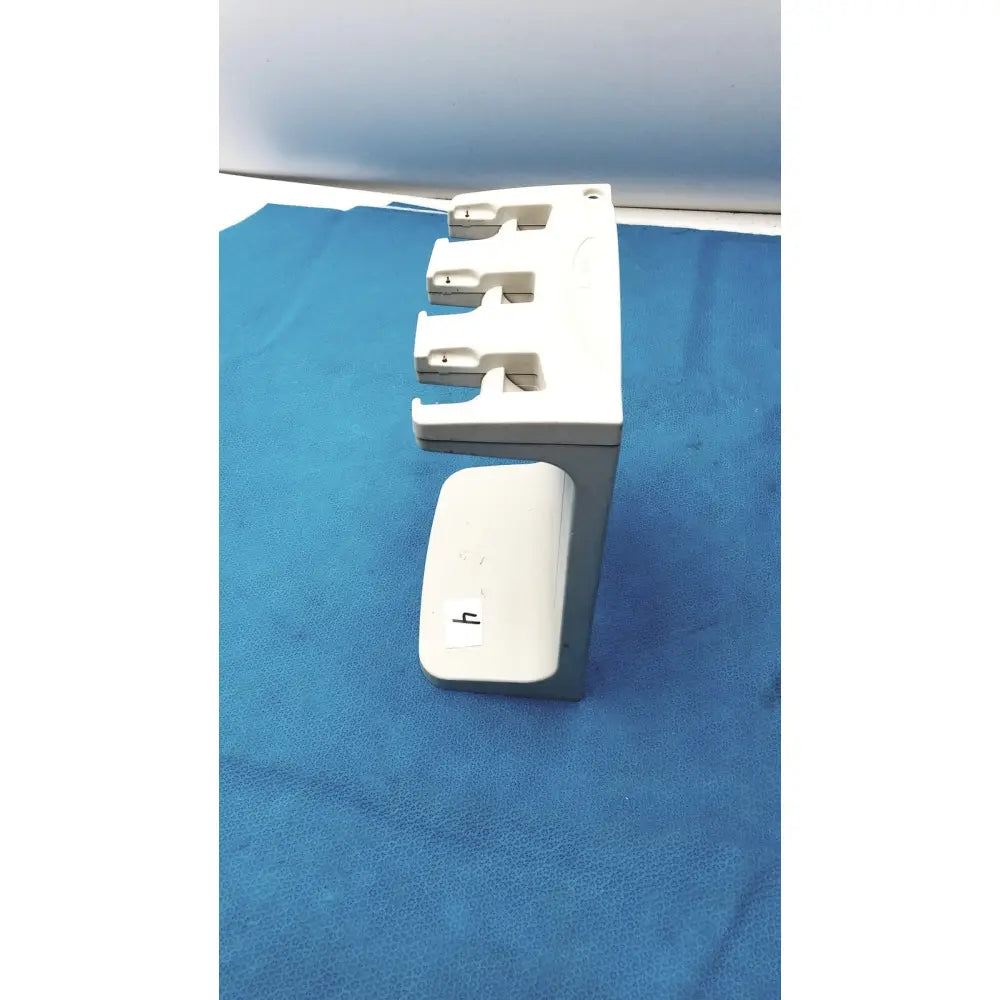 White plastic rainin e3 rapid charger stand with three slots and a small compartment for rapid charger organization