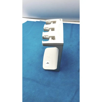 White plastic rainin e3 rapid charger stand with three slots and a small compartment for rapid charger organization