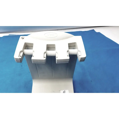White plastic dental handpiece holder with three adjustable slots for instruments in rainin e3 rapid charger stand