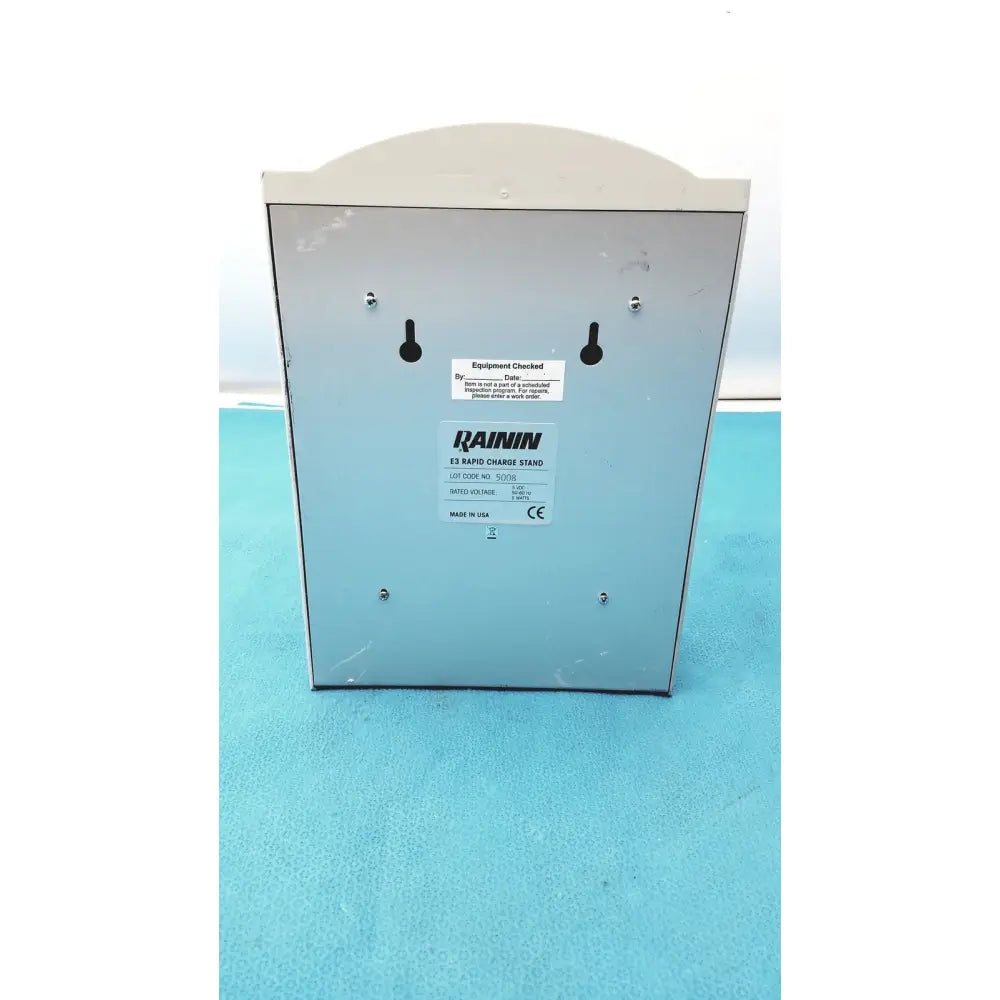 Light gray metallic rainin e3 rapid charger stand with curved top and mounting holes for secure installation