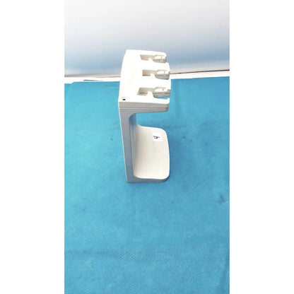 White plastic rainin e3 rapid charger stand with three slots for charging devices in a rapid charger design