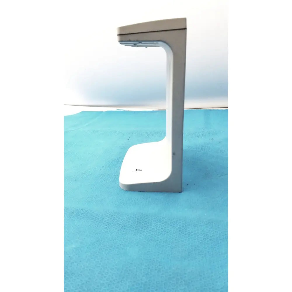 Gray and white plastic rainin e3 rapid charger stand with a curved modern design for efficient rapid charging