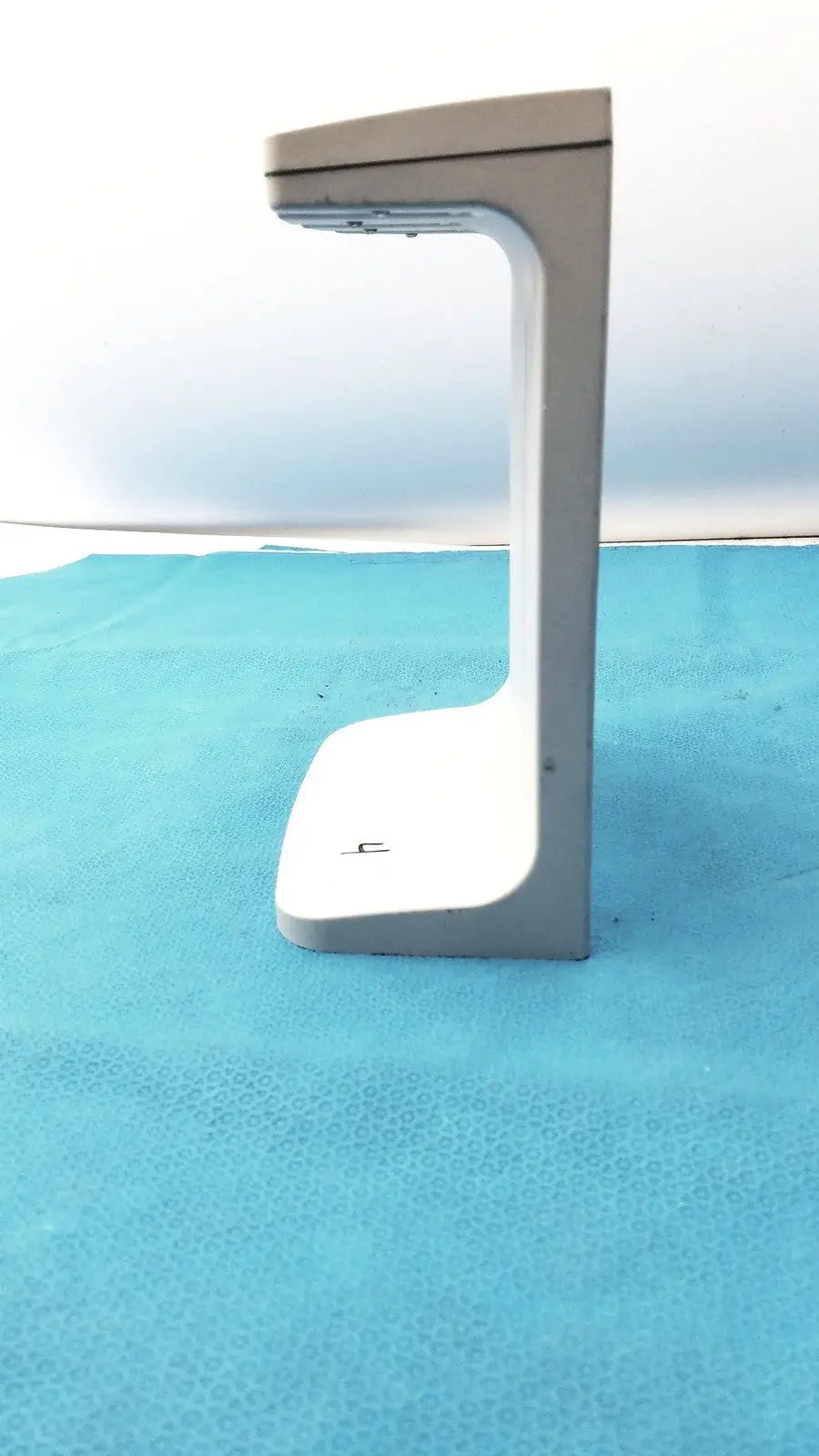 Gray and white plastic rainin e3 rapid charger stand with a curved modern design for efficient rapid charging
