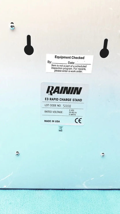 Light blue rainin e3 rapid charger stand with black mounting holes and white label showing technical specifications