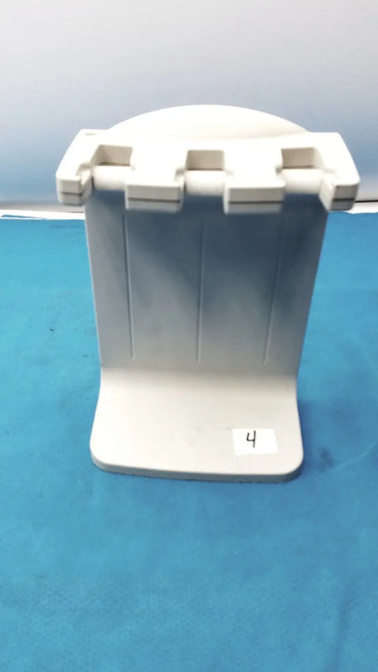 White plastic Rainin E3 Rapid rapid charger stand with three vertical slots for holding books or devices