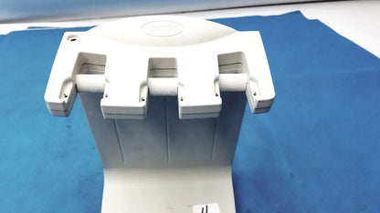 White plastic dental handpiece holder with three adjustable slots for instruments in rainin e3 rapid charger stand