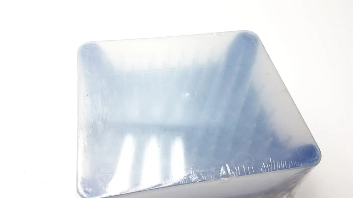 A translucent blue plastic rainin hr-1000 liftcover container with textured surface and rounded edges for reuse medical tips