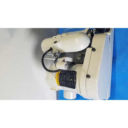 White industrial-grade wall-mounted ray foster high speed dental alloy grinder with black hoses and yellow-black label