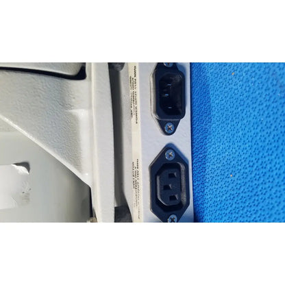 Black plastic power input connectors on the back panel of the ray foster high speed dental alloy grinder ag05
