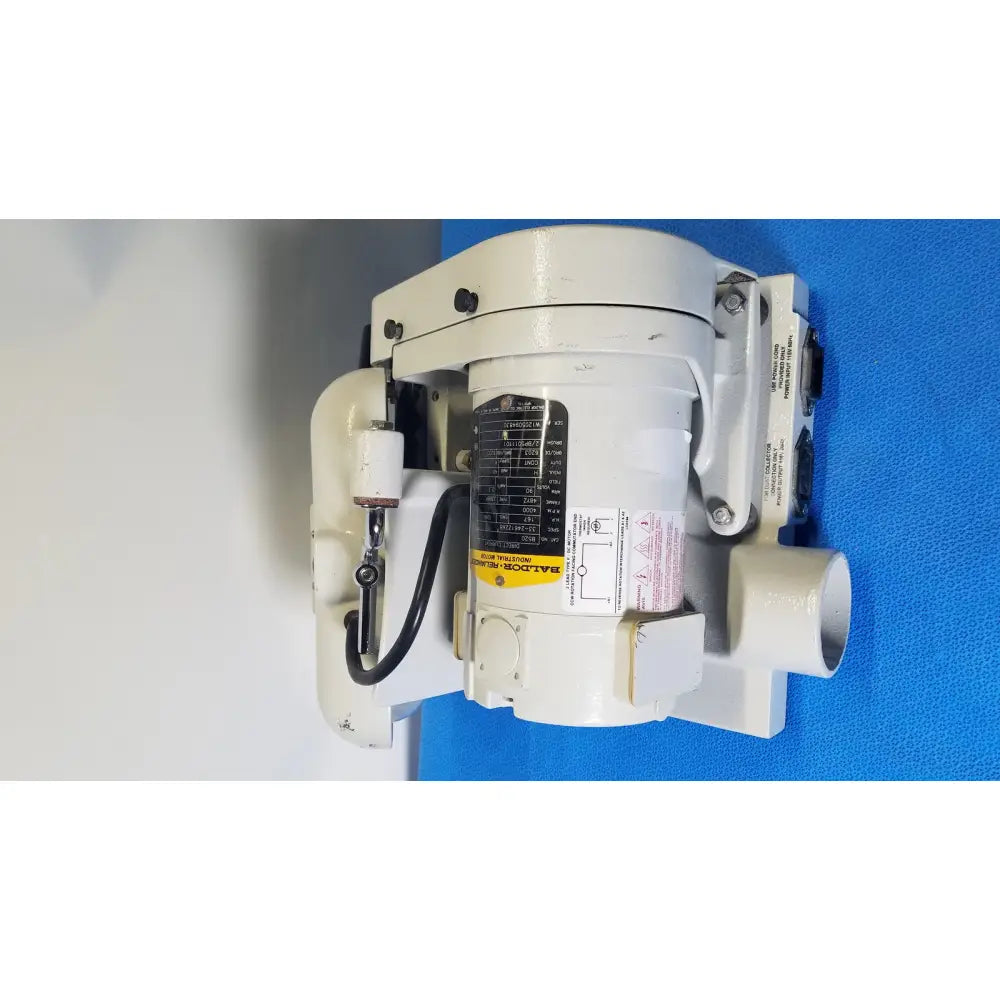 White industrial pump with cylindrical body black wiring and control panels for ray foster high speed dental alloy grinder ag05