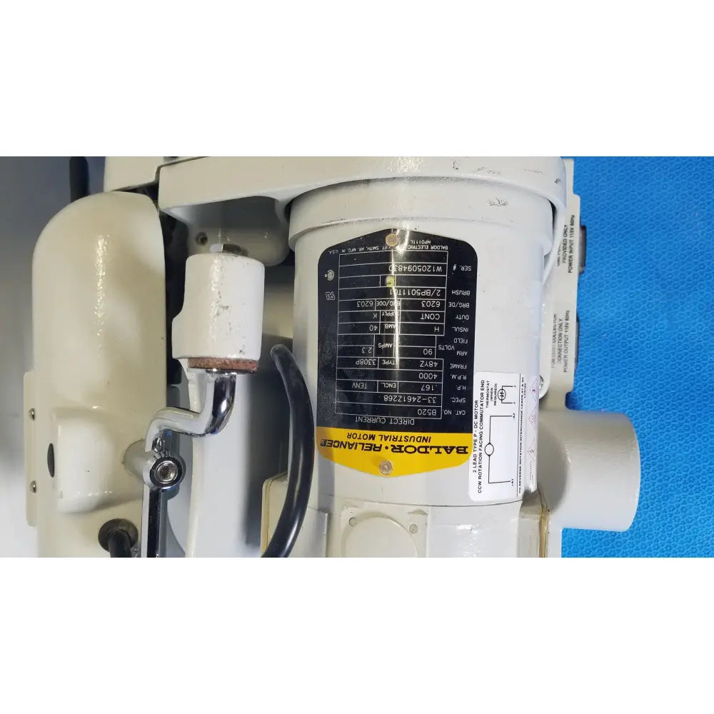 White industrial motor with black and yellow baldor label for ray foster high speed dental alloy grinder ag05