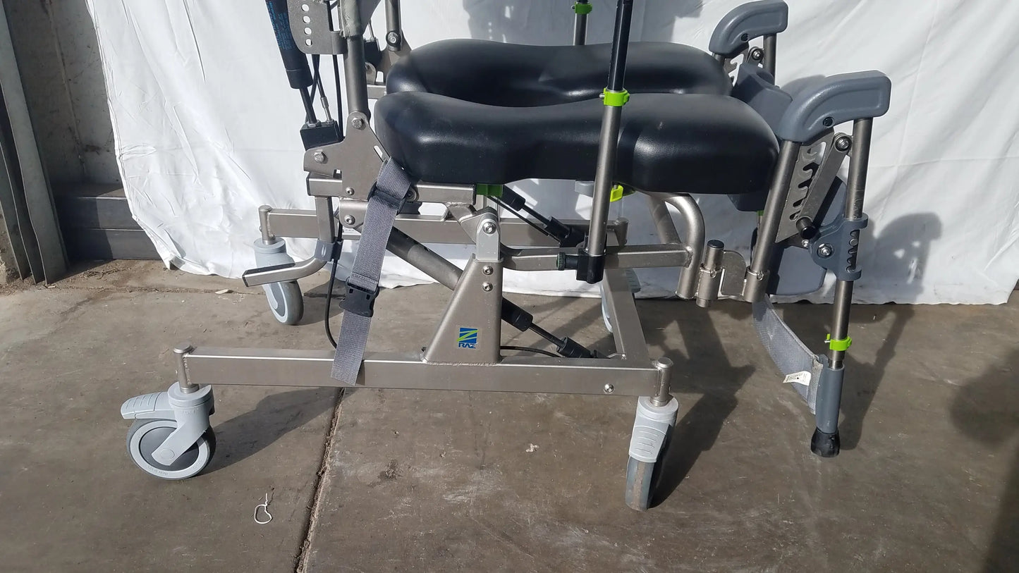 Gray and black adjustable raz attendant tilt shower commode chair with padded seat footrest metal frame and caster wheels