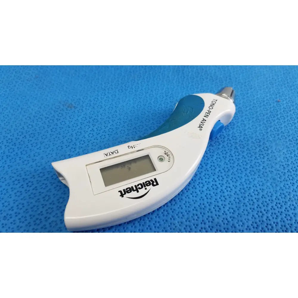 White and teal reichert tono pen avia handheld tonometer with metallic tip and small digital screen in a protective case