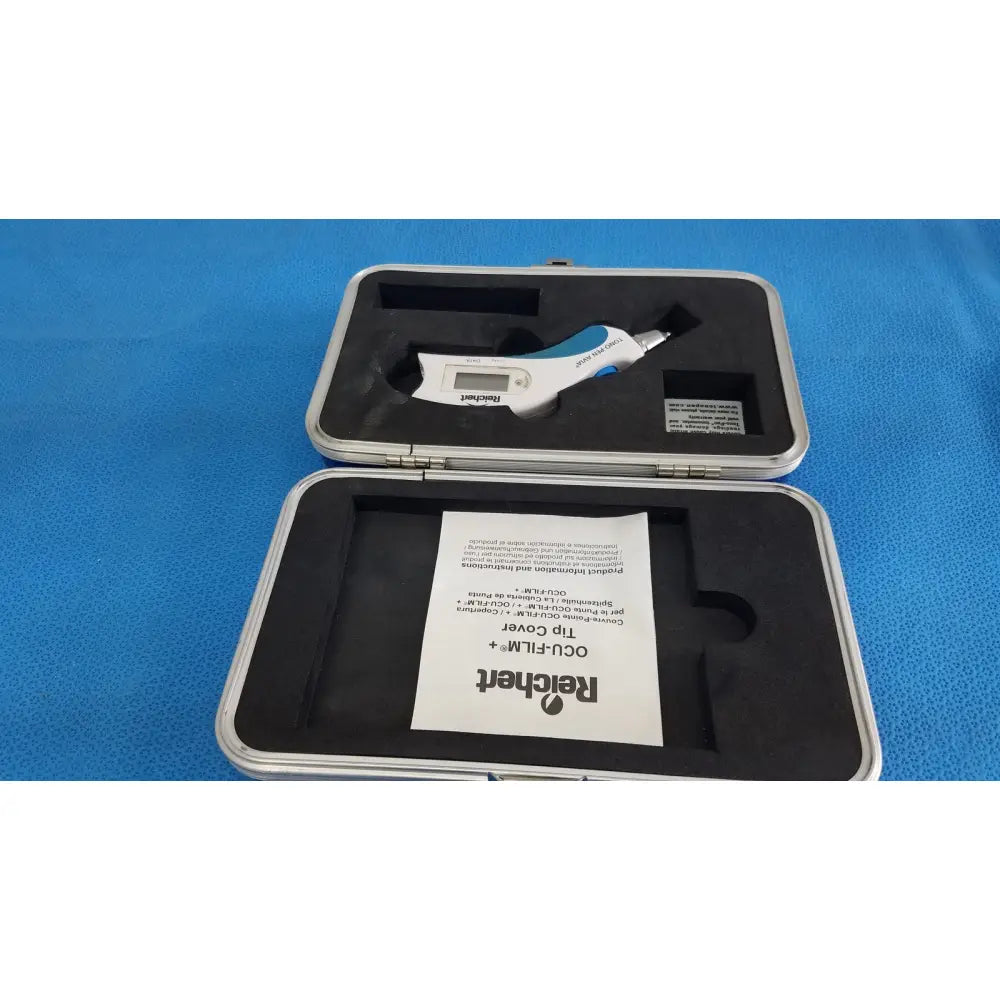 White and blue digital caliper in silver case displayed with reichert tono pen avia handheld tonometer case