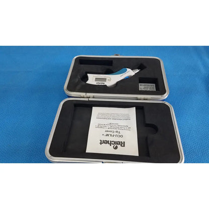 White and blue digital caliper in silver case displayed with reichert tono pen avia handheld tonometer case