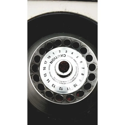 Silver metallic spare tire hubcap with numbered holes and safety warning for reliable scientific quick spin micro centrifuge 115v