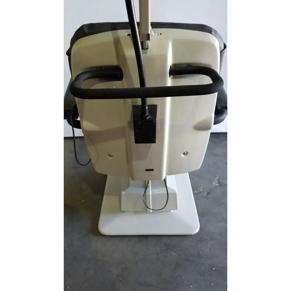 Beige and black reliance medical products model 6100 exam chair with sturdy base curved armrests and integrated cable management