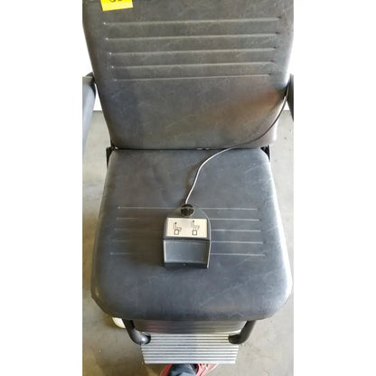 Black upholstered mobility scooter seat with control panel on cushion for reliance medical products model 6100 exam chair