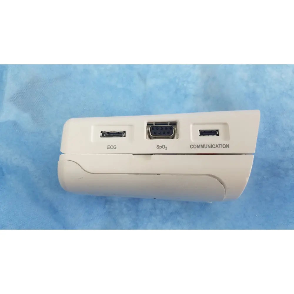 White medical device back side with three ports labeled ecg spo2 and communication from respironics alice pdx system