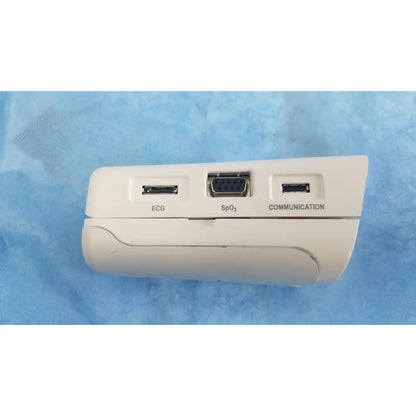 White medical device back side with three ports labeled ecg spo2 and communication from respironics alice pdx system
