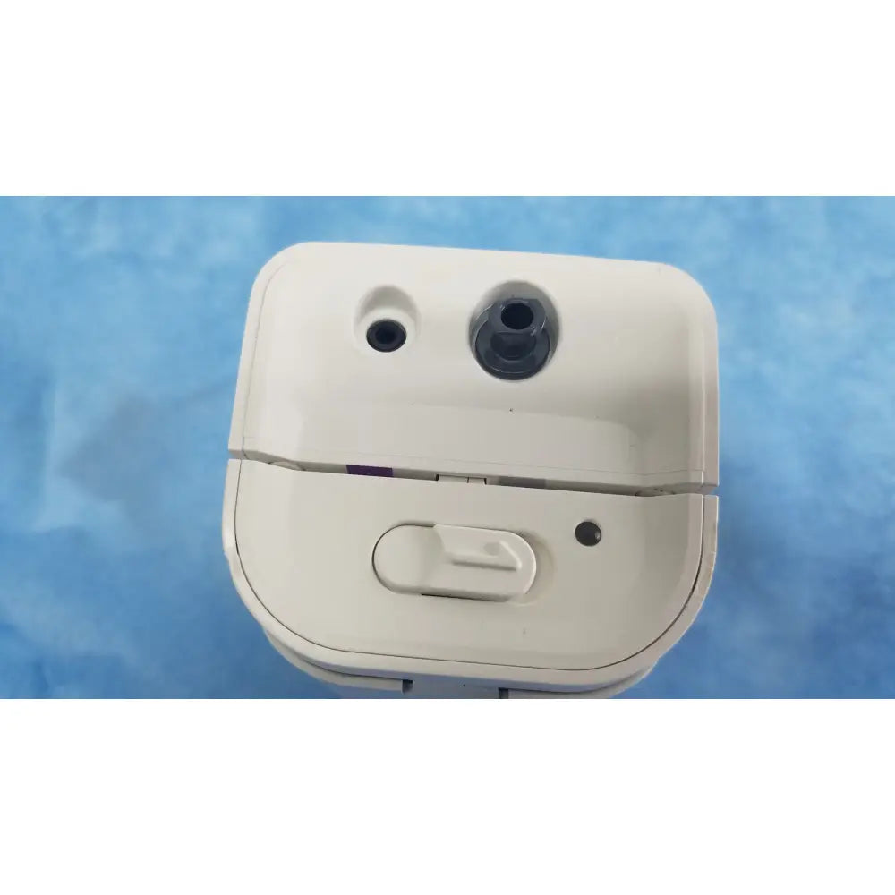 White plastic charging case for wireless earbuds with rounded design and slider switch for respironics alice pdx system