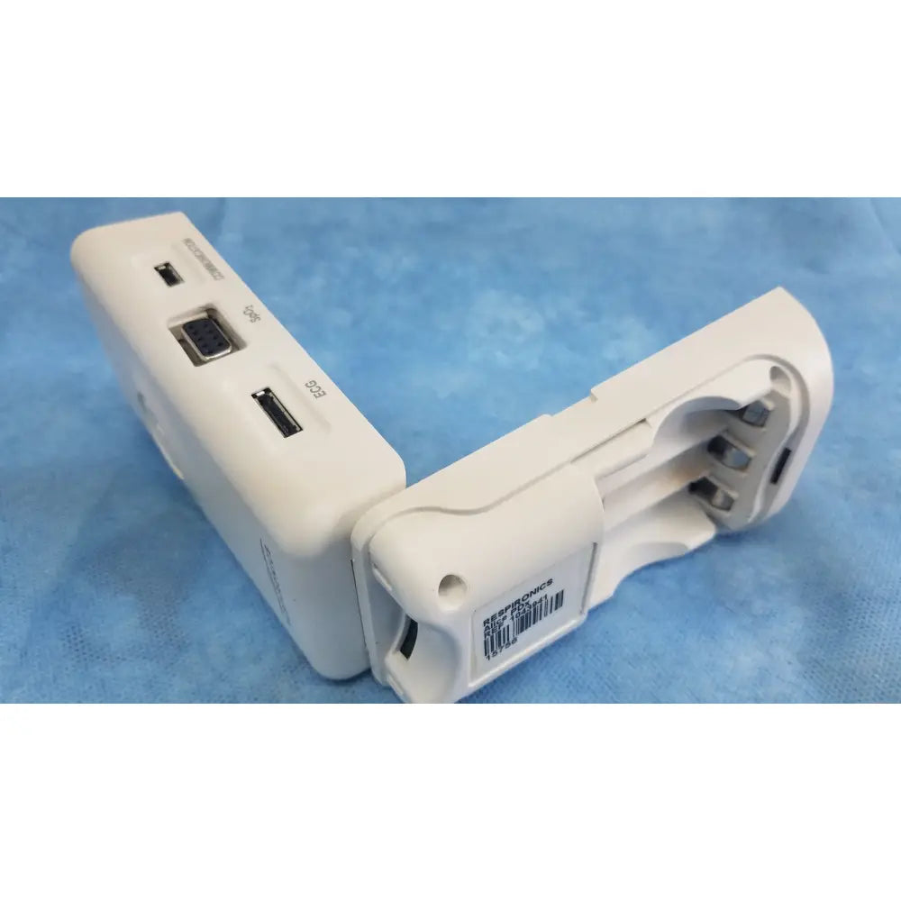 White plastic respironics alice pdx portable sleep diagnostic system back with multiple ports including usb and serial connectors