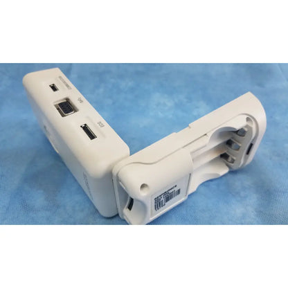 White plastic respironics alice pdx portable sleep diagnostic system back with multiple ports including usb and serial connectors