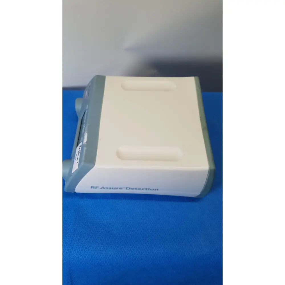 White and gray rf assure detection console model 200x with sleek rectangular design for reliable assure detection
