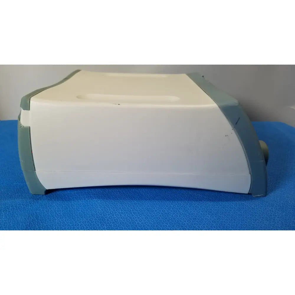 White and gray plastic RF Assure detection console Model 200X with curved rectangular body for assure detection use