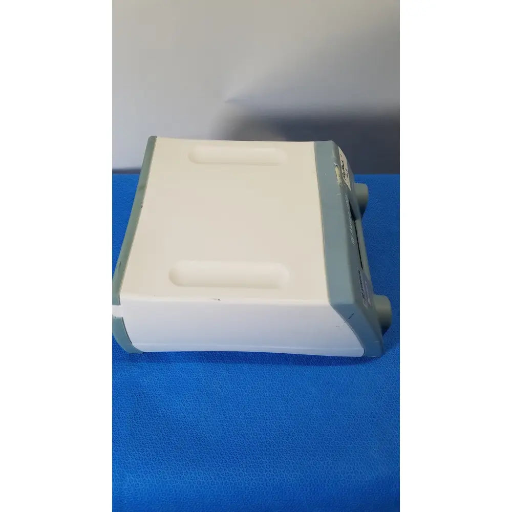 White and gray RF Assure Detection Console model 200X with rectangular body and recessed top handles for easy transport