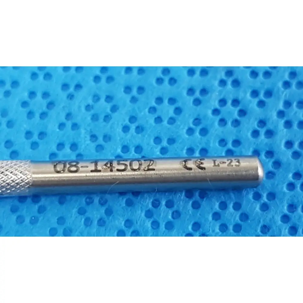 Silver angled titanium lindstrom star manipulator surgical tool with textured grip and engraved markings