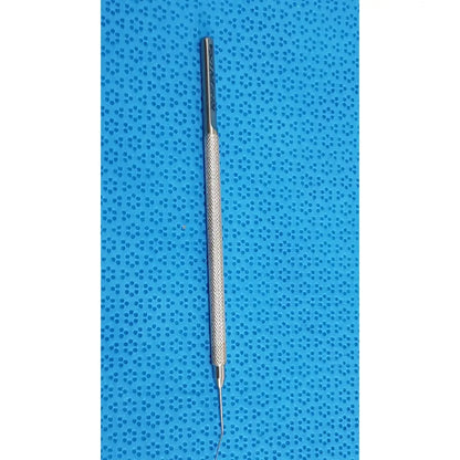 Silver-colored titanium lindstrom star manipulator surgical tool with textured grip and fine curved tip for precision use