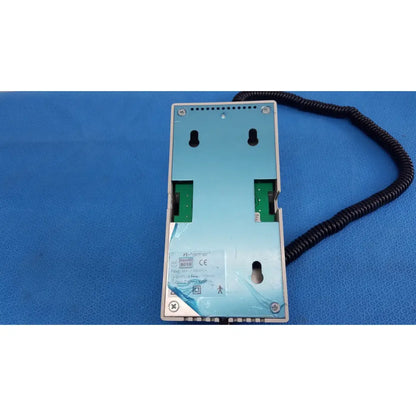 Light blue ri-former diagnostic station extension module with green circuit boards and black coiled cable attached