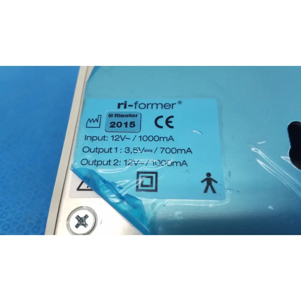 Blue plastic label with black text for ri-star ri-former diagnostic station extension power supply module