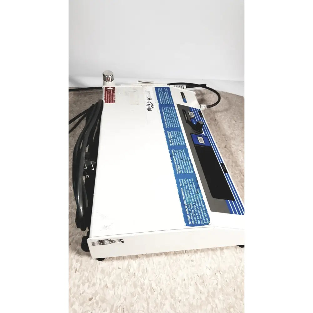 White rectangular rich-mar theramini 3c combo ultrasound electrical stimulation unit with blue labeling and black control panel