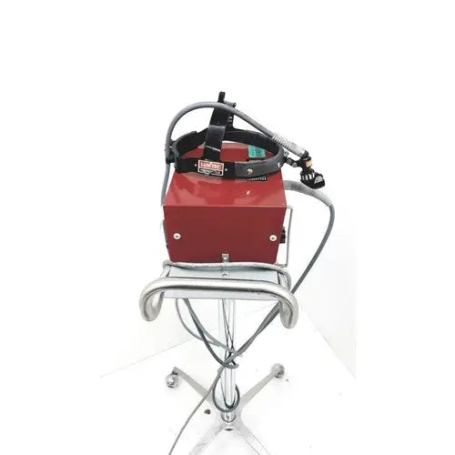 Red rectangular richard wolf 4046.00 fiber light projector with black headband and silver metal stand for fiber light use