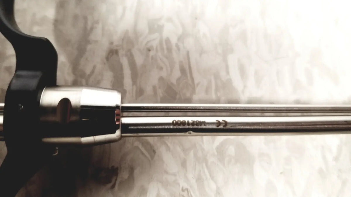 A sleek metallic richard wolf m821800 resectoscope with black ergonomic handle and polished stainless steel shaft for reuse medical use