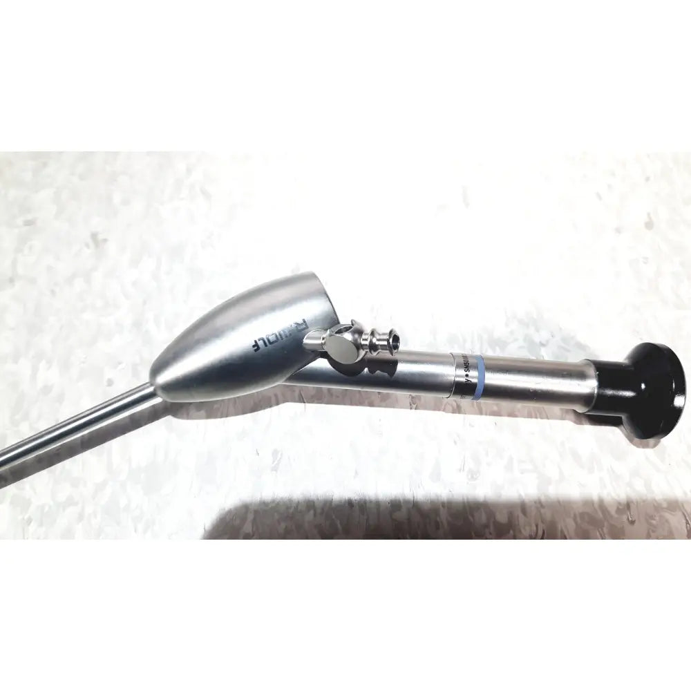 Silver metallic richard wolf mini cystoscope with tapered head and black grip in mini cystoscope tray 8585.024