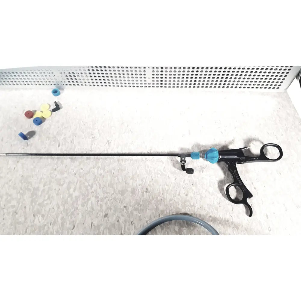 Richard wolf mini cystoscope with black and blue ergonomic handles and adjustable components in mini cystoscope tray