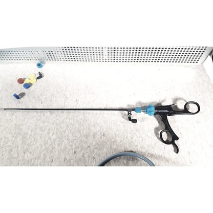 Richard wolf mini cystoscope with black and blue ergonomic handles and adjustable components in mini cystoscope tray