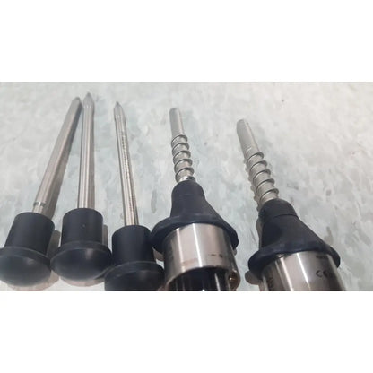 Five metallic drill bits with black rubberized handles in the richard wolf 8585.024 mini cystoscope tray for precise drilling tasks