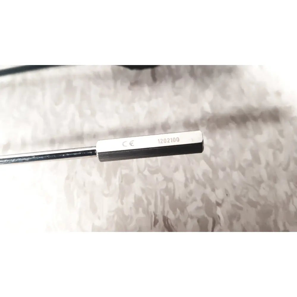 Silver-colored metal sensor with rectangular engraved head in richard wolf mini cystoscope tray for urological use