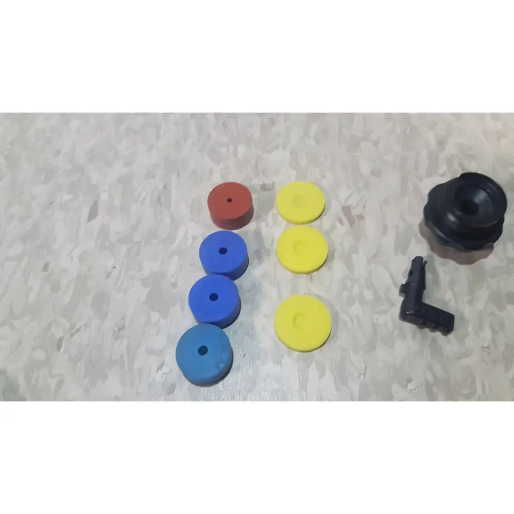 Set of colorful red blue and yellow rubber grommets with black fitting in richard wolf 8585 024 mini cystoscope tray