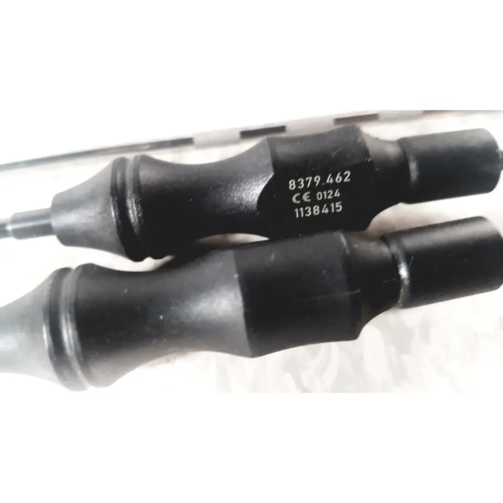 Black rubber-handled tool with metallic shaft and engraved serial numbers from richard wolf mini cystoscope tray 8585.024