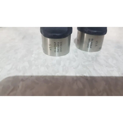 Two metallic cylindrical measuring tools with black rubber tops from richard wolf mini cystoscope tray model 8585.024