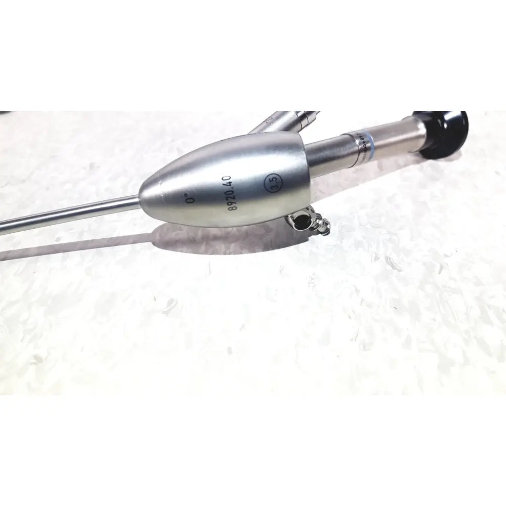Silver surgical endoscope with sleek metallic body and black-tipped handle in richard wolf 8585.024 mini cystoscope tray