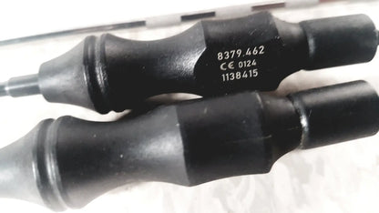 Black rubber-handled tool with metallic shaft and engraved serial numbers from richard wolf mini cystoscope tray 8585.024