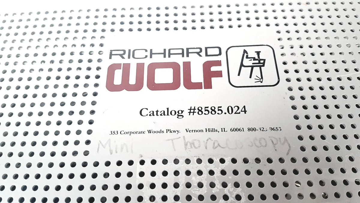 Richard Wolf 8585.024 mini cystoscope tray label with red and black text on white perforated metal surface