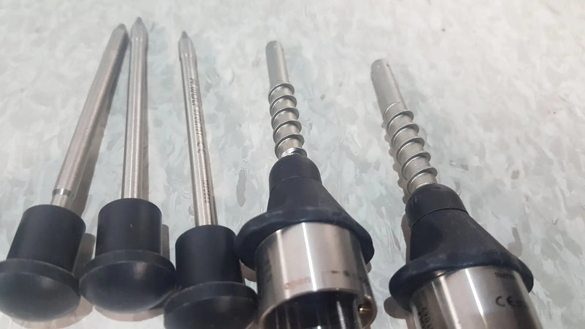 Five metallic drill bits with black rubberized handles in the richard wolf 8585.024 mini cystoscope tray for precise drilling tasks