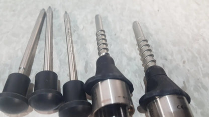 Five metallic drill bits with black rubberized handles in the richard wolf 8585.024 mini cystoscope tray for precise drilling tasks